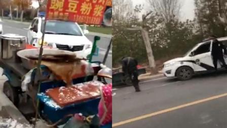 城管车剐蹭小贩车，豆腐脑洒小贩一身致烫伤